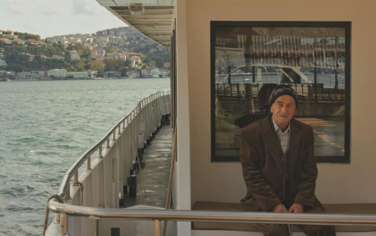 An older traveler on a boat.