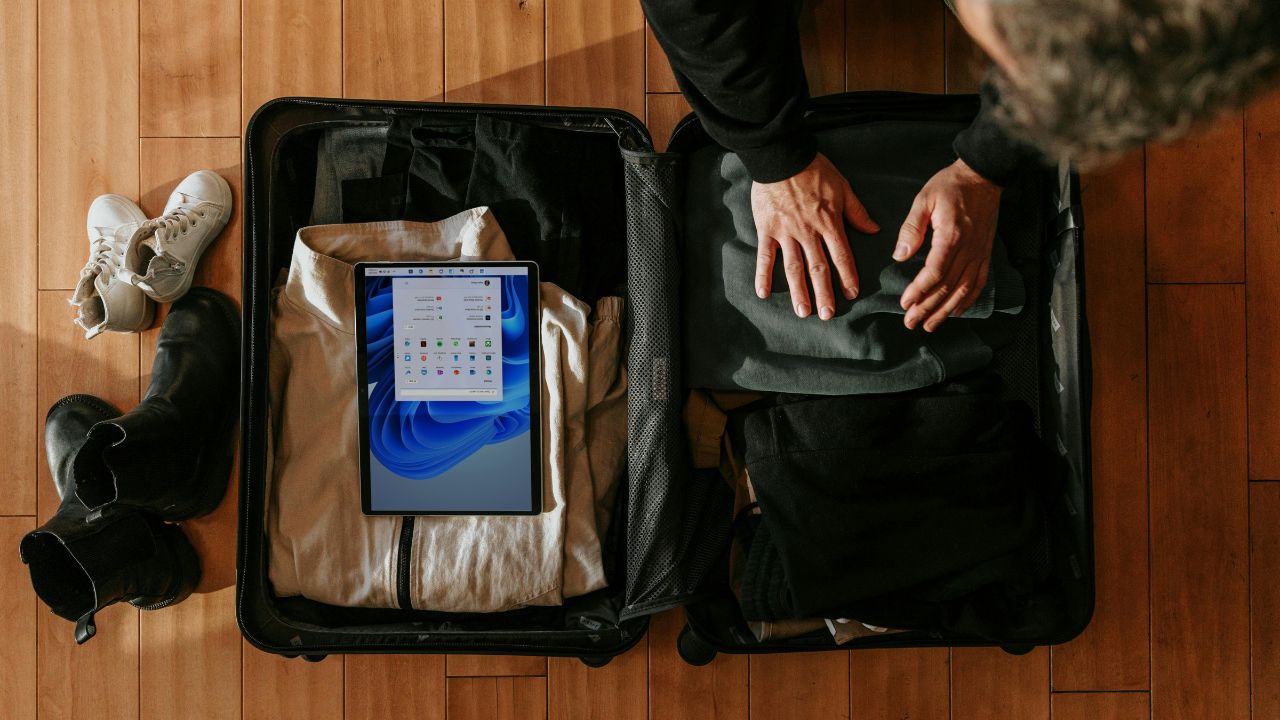 Someone packing a suitcase