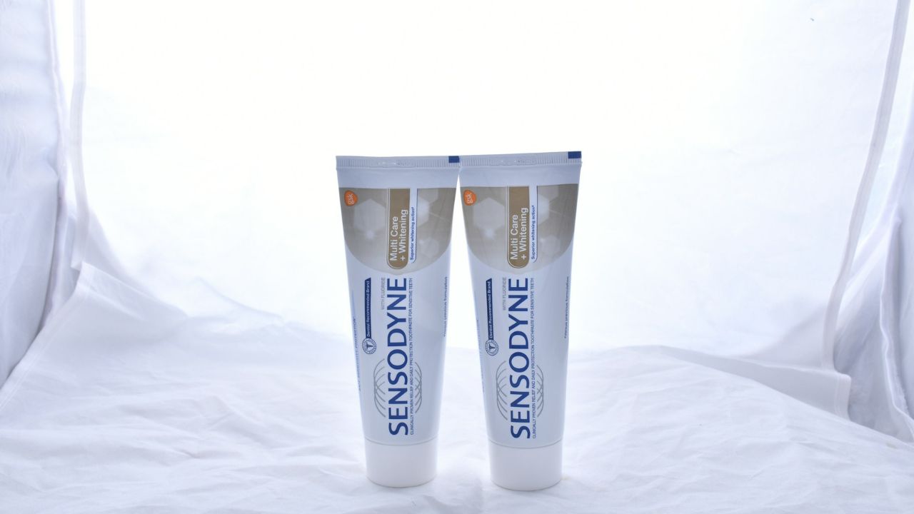 Two travel-sized toothpaste containers